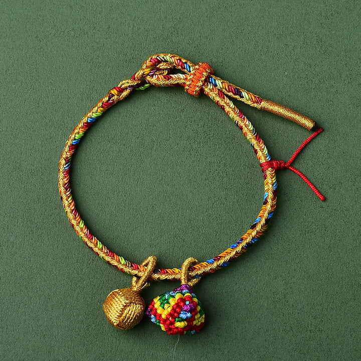 Pulsera con dije de bola dorada Zongzi hecha a mano con cuerda colorida y Buddha Stones