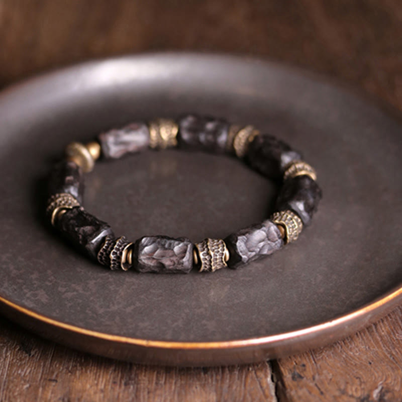 Pulsera de paz tranquila de cobre y madera de ébano tibetano con Buddha Stones