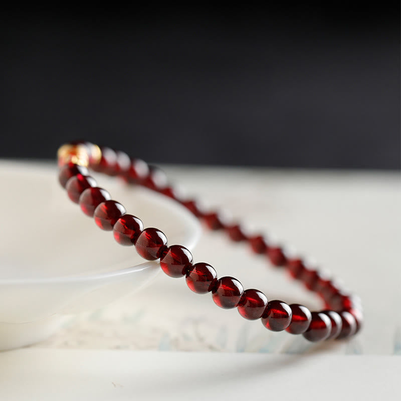 Pulsera de protección con granate natural y pez Koi de oro 999 de Buddha Stones - image 3