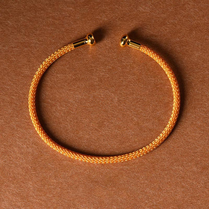 Pulsera de cuerda trenzada de la suerte hecha a mano con diseño simple de Buddha Stones