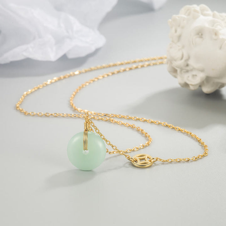 Collar con colgante de abundancia con hebilla de paz y moneda de cobre con carácter de Jade Fu de Buddha Stones