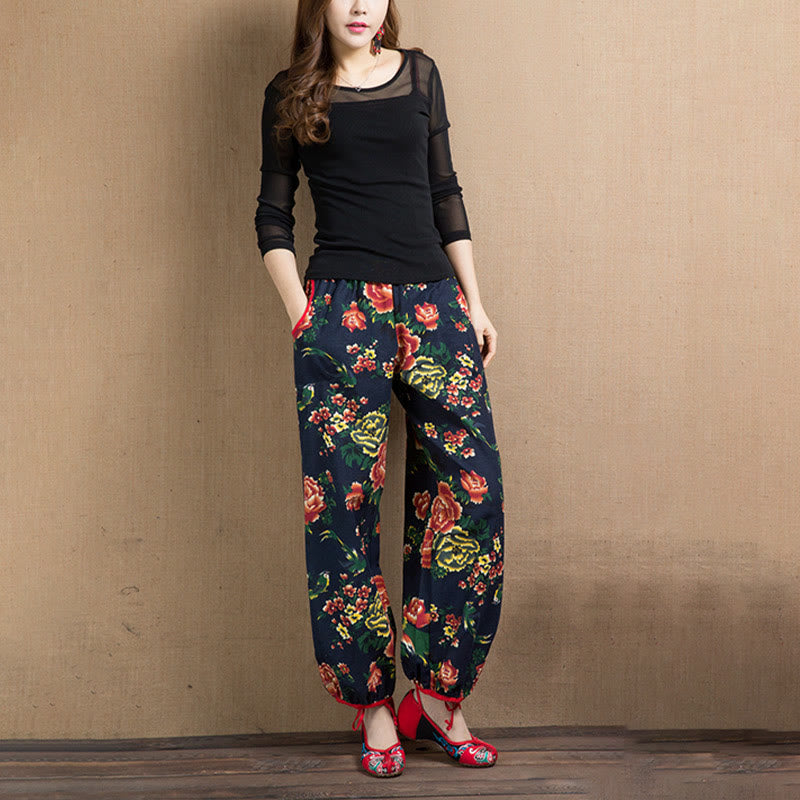 Pantalones bombachos con estampado de flores rojas y verdes de estilo étnico con Buddha Stones y bolsillos