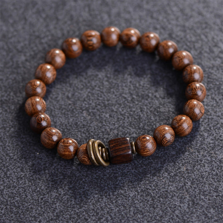 Pulsera de espiritualidad de madera de Phoebe Zhennan con Buddha Stones