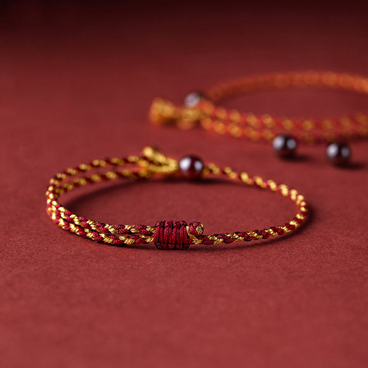 Pulsera trenzada con dije de paz y alegría de loto de cuerda de oro rojo hecha a mano con Buddha Stones