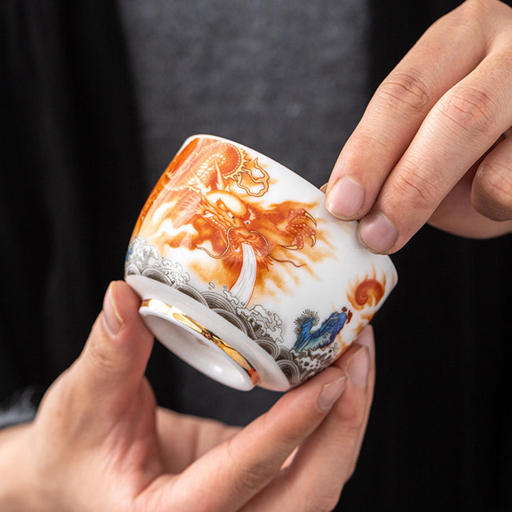 Buddha Stones Dragón Fénix Grulla Sol Océano Olas Taza de té de cerámica dorada Taza de té de Kung Fu 170 ml