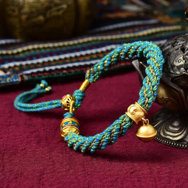 Pulsera de cuerda trenzada con dije de campana y rueda de oración Thangka de protección de la suerte hecha a mano tibetana