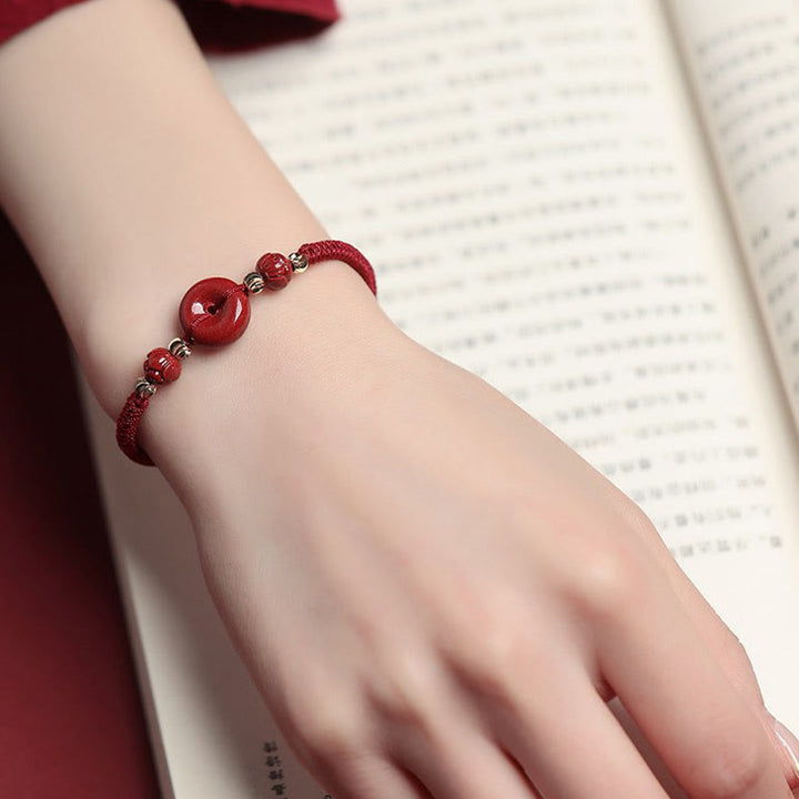 Pulsera trenzada de bendición con hebilla de paz y cinabrio de loto hecha a mano con Buddha Stones