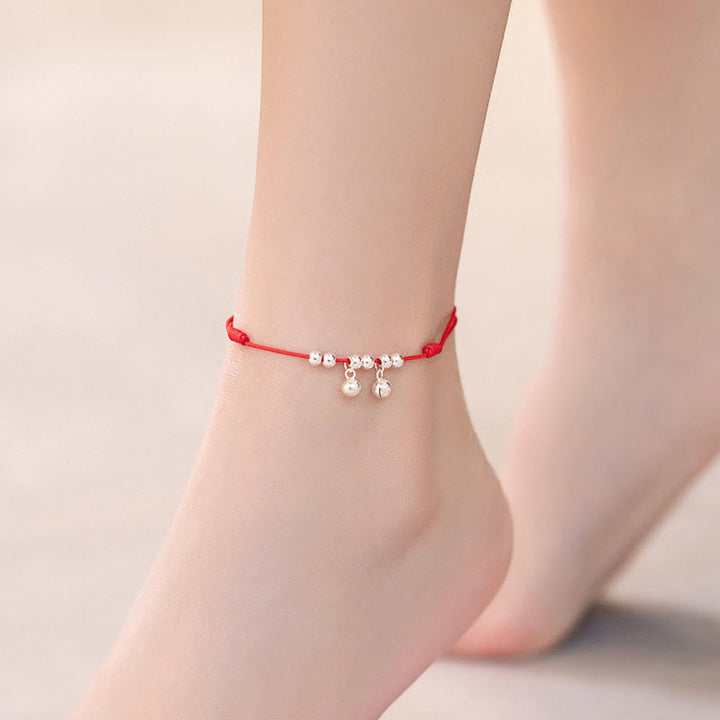 Tobillera con dije de campana trenzada con hilo rojo de plata de ley 925 con Buddha Stones