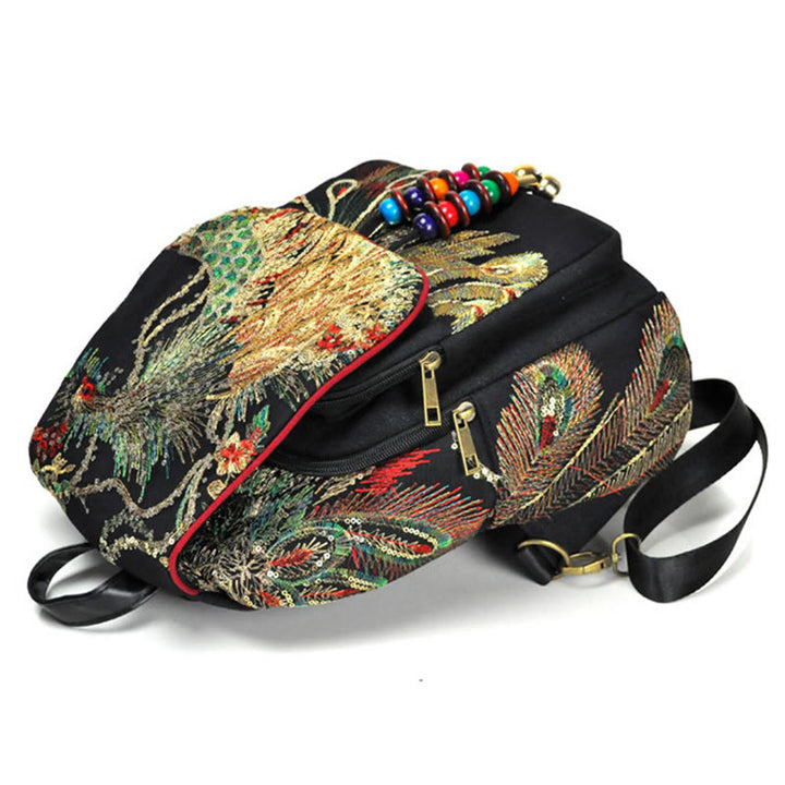 Mochila con borlas de lona con bordado de pavo real