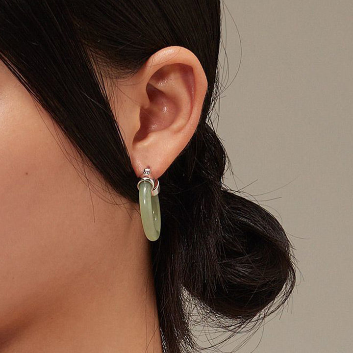 Pendientes de prosperidad de jade blanco redondo de Buddha Stones