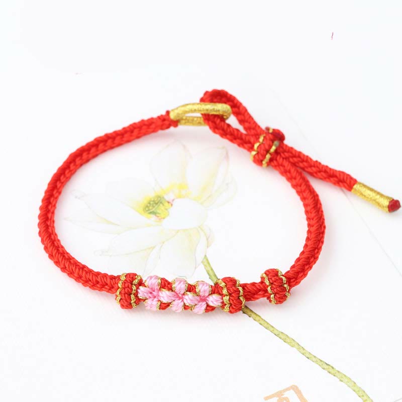 Pulsera de cuerda trenzada de ocho hebras de la suerte con tres flores de melocotón hechas a mano con Buddha Stones