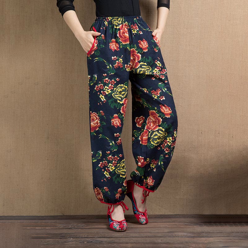 Pantalones bombachos con estampado de flores rojas y verdes de estilo étnico con Buddha Stones y bolsillos