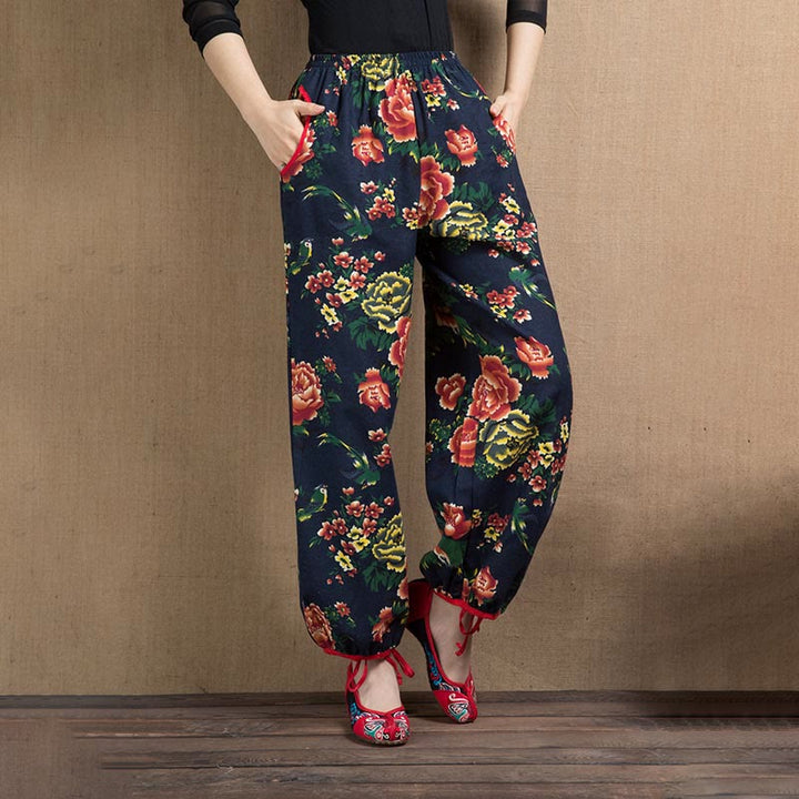Pantalones bombachos con estampado de flores rojas y verdes de estilo étnico con Buddha Stones y bolsillos