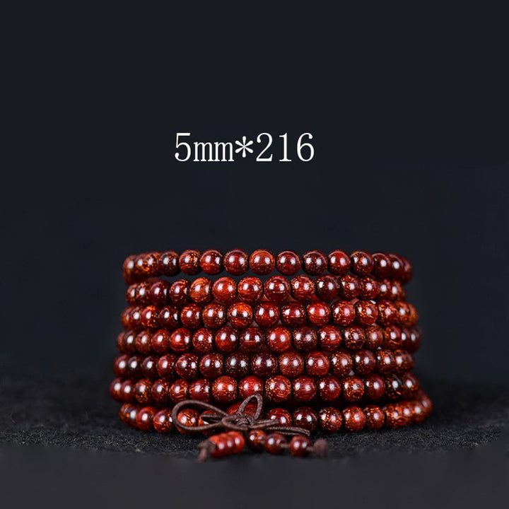 Pulsera de equilibrio de sándalo rojo con hoja pequeña tibetana de Buddha Stones