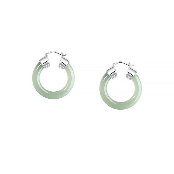 Pendientes de prosperidad de jade blanco redondo de Buddha Stones