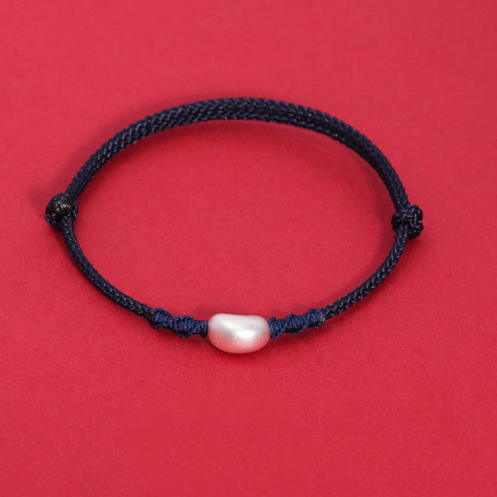 Pulsera trenzada hecha a mano con diseño de frijol de plata de ley 999 con Buddha Stones