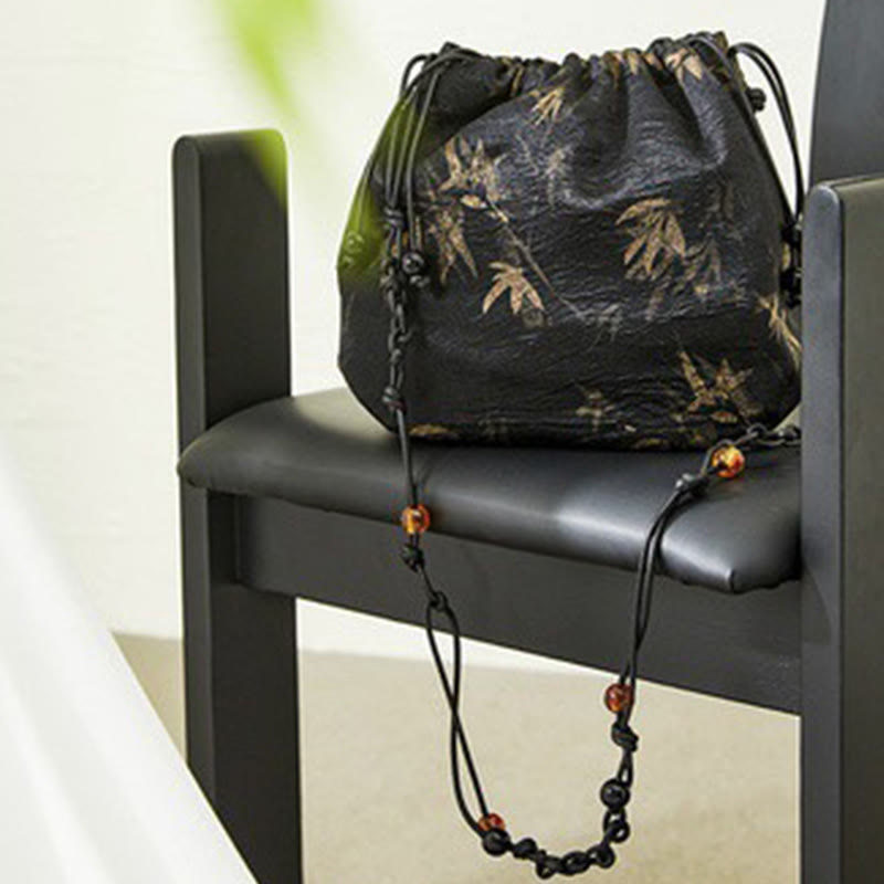 Bolso bandolera de acetato con estampado de hojas de bambú amarillo con Buddha Stones