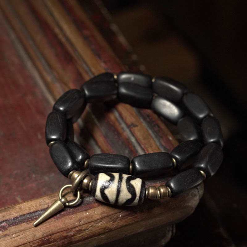 Pulsera de doble envoltura con cuentas Dzi de madera de ébano del Tíbet con Buddha Stones