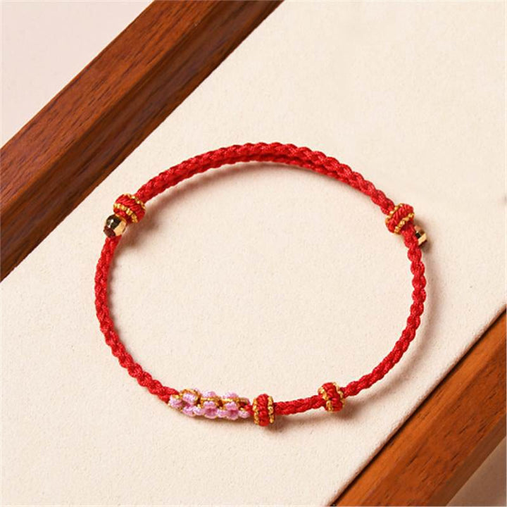 Pulsera de cuerda trenzada con protección de flor de melocotón hecha a mano con Buddha Stones
