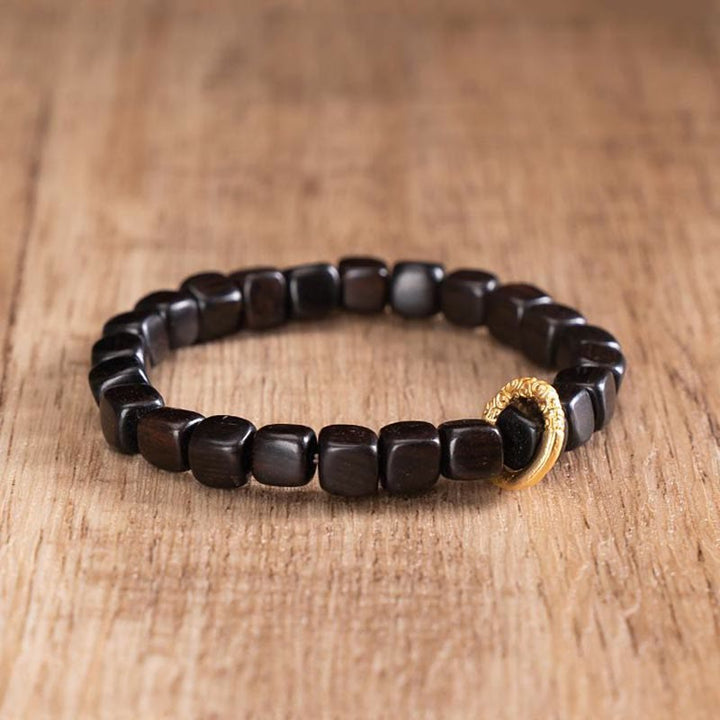 Pulsera de equilibrio de cuentas Dzi de madera de ébano tibetano con Buddha Stones