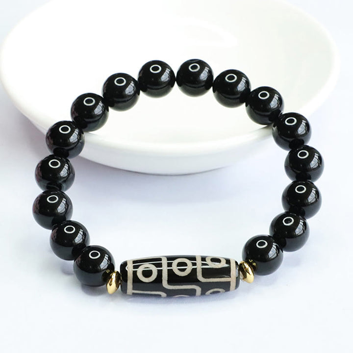Pulsera de poder de ónix negro con cuentas Dzi tibetanas de nueve ojos de Buddha Stones