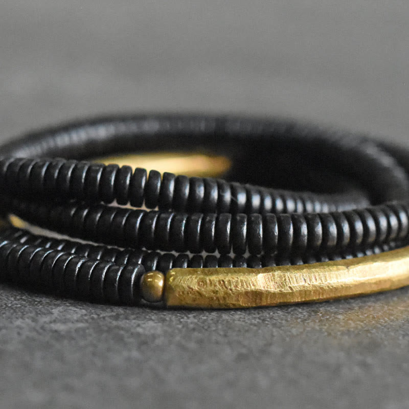 Pulsera multicapa con equilibrio de cobre y madera de ébano con Buddha Stones