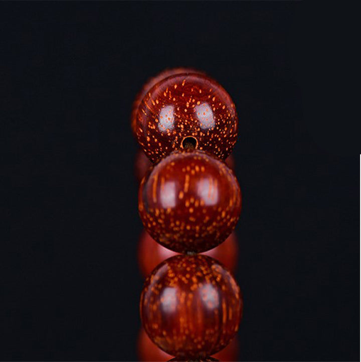 Pulsera de equilibrio de sándalo rojo con hoja pequeña tibetana de Buddha Stones