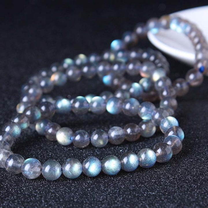 Pulsera de cuentas curativas de piedra lunar natural de piedras de Buddha Stones - image 13