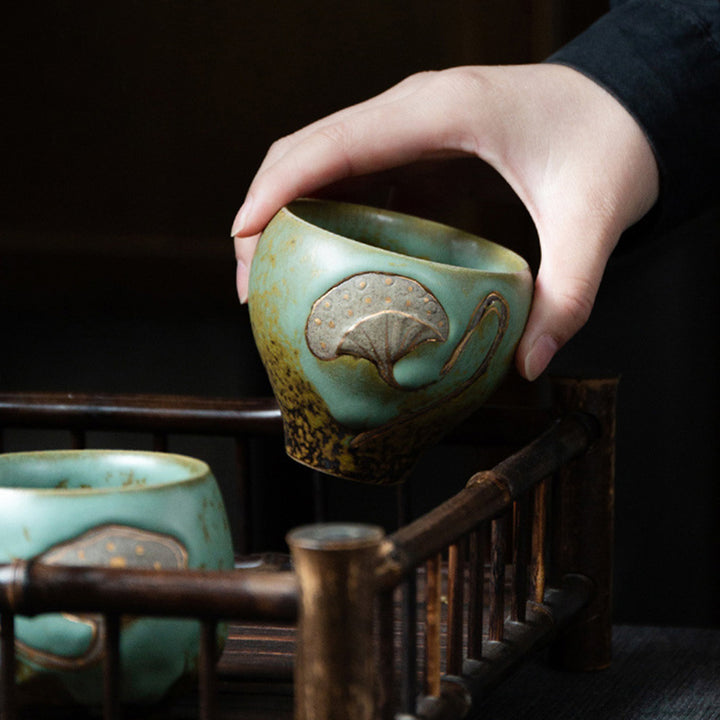 Taza de té de Kung Fu con Buddha Stones , vaina de loto grabada