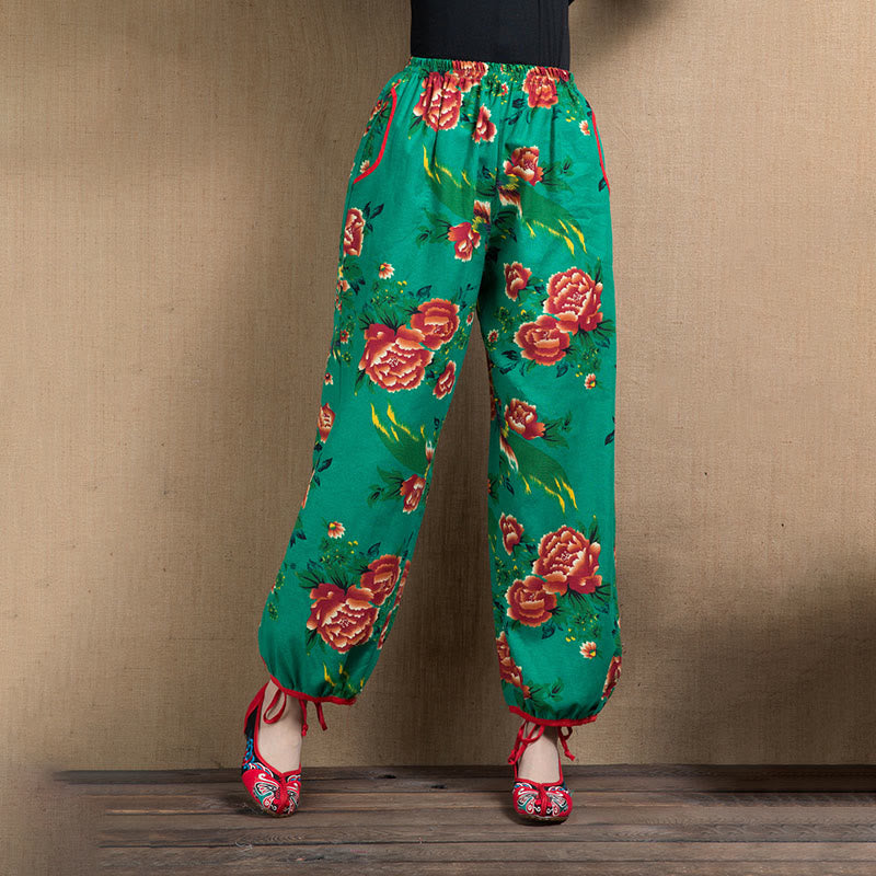 Pantalones bombachos con estampado de flores rojas y verdes de estilo étnico con Buddha Stones y bolsillos