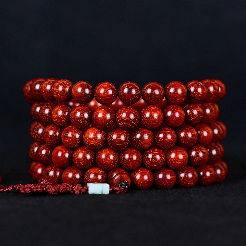 Pulsera de equilibrio de sándalo rojo con hoja pequeña tibetana de Buddha Stones