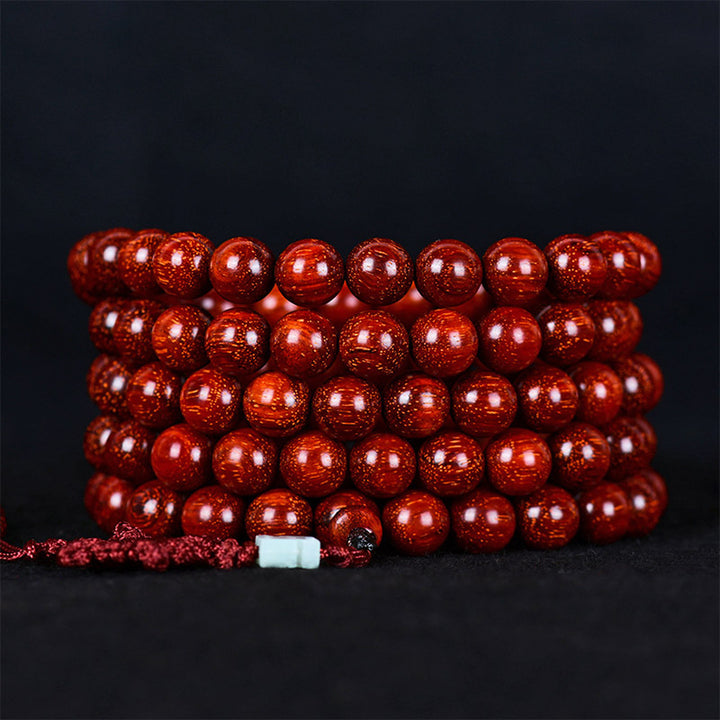 Pulsera de equilibrio de sándalo rojo con hoja pequeña tibetana de Buddha Stones