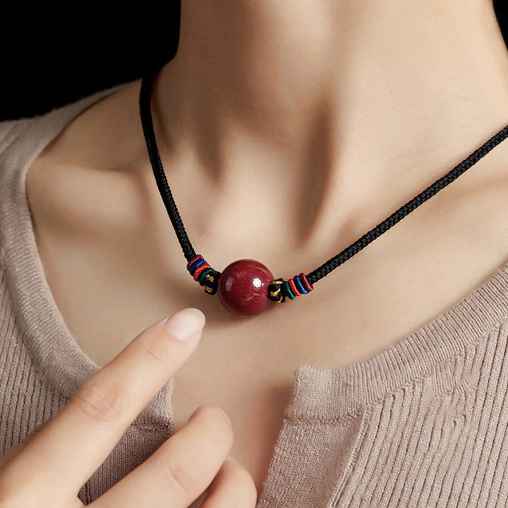 Collar con colgante de cadena con cuentas de cinabrio y Buddha Stones