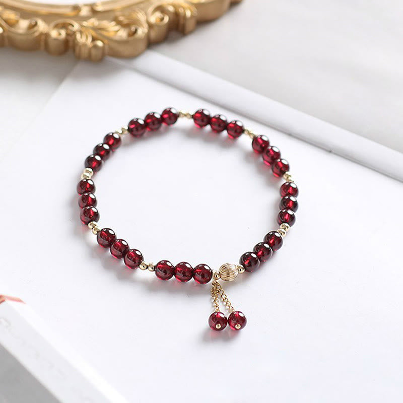 Pulsera Calm de granate natural de oro de 14 quilates con Buddha Stones