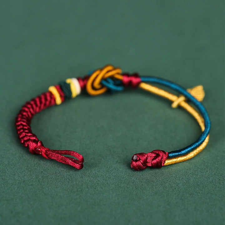 Pulsera de cuerda de la suerte con nudo de mandala hecha a mano tibetana con Buddha Stones