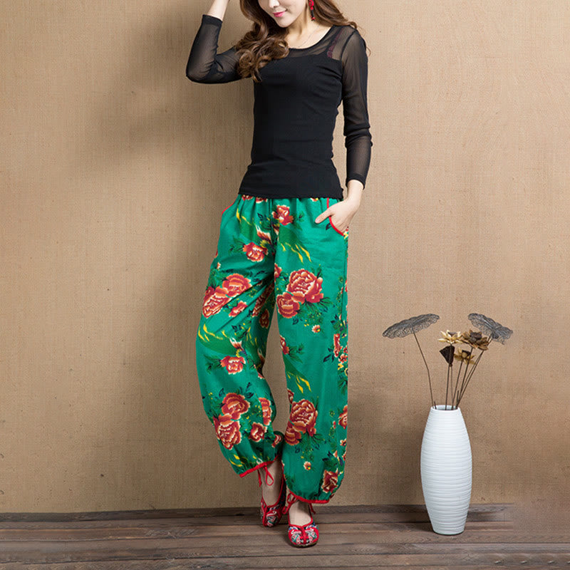 Pantalones bombachos con estampado de flores rojas y verdes de estilo étnico con Buddha Stones y bolsillos