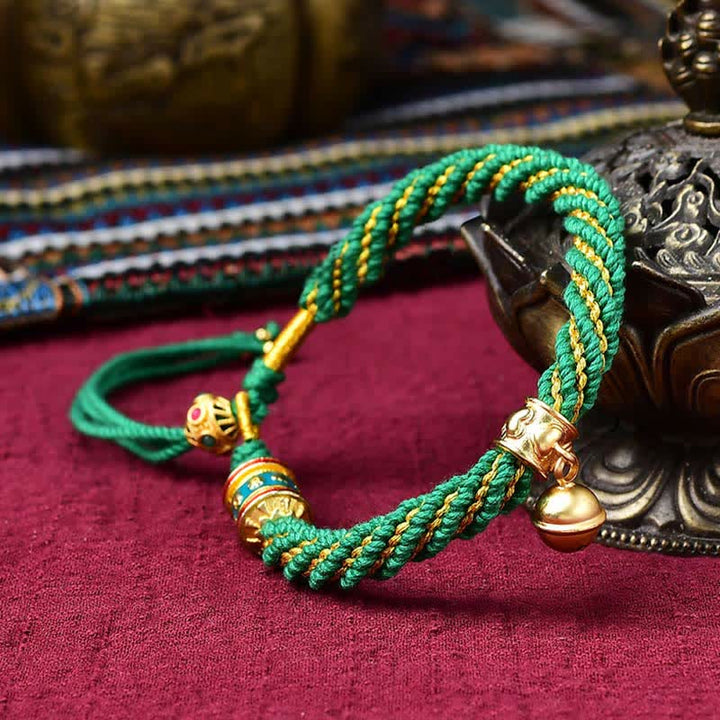 Pulsera de cuerda trenzada con dije de campana y rueda de oración Thangka de protección de la suerte hecha a mano tibetana