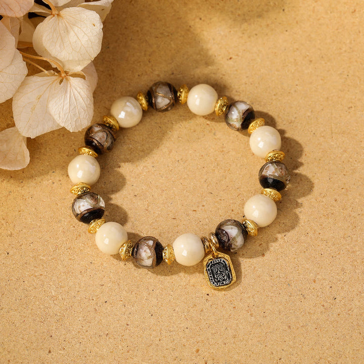 Buddha Stones tibetano Zakiram diosa de la riqueza encanto Liuli vidrio incienso ceniza porcelana pulsera de protección de cuentas