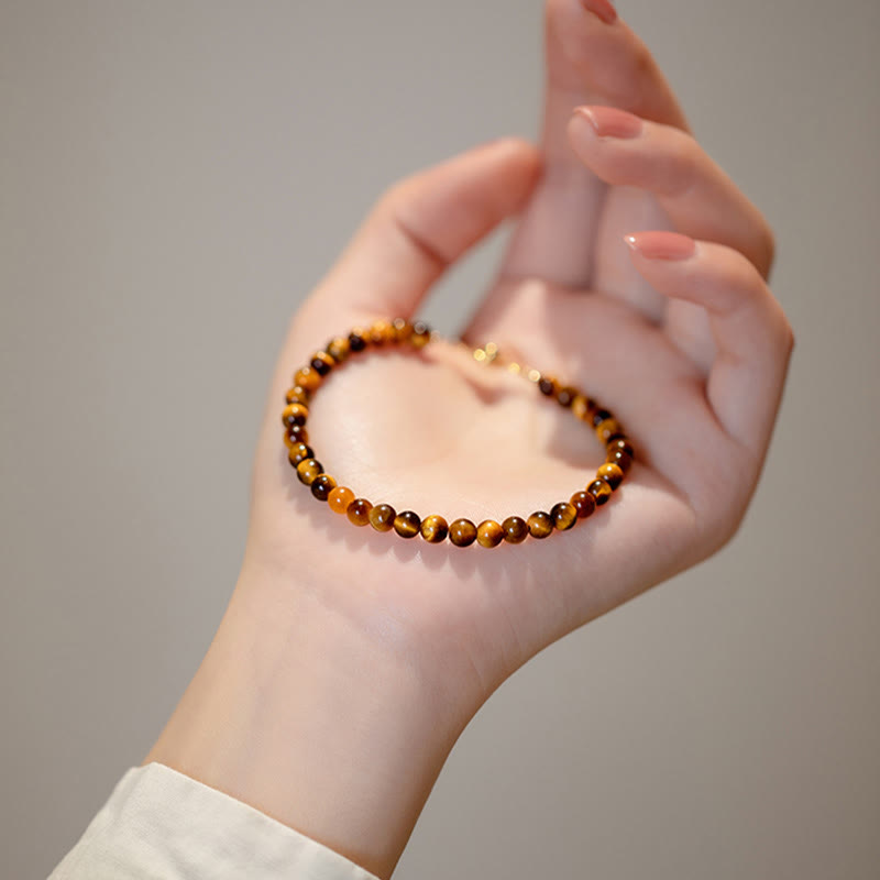Buddha Stones Pulsera de protección de coraje con piedra de ojo de tigre natural chapada en oro de 14 quilates