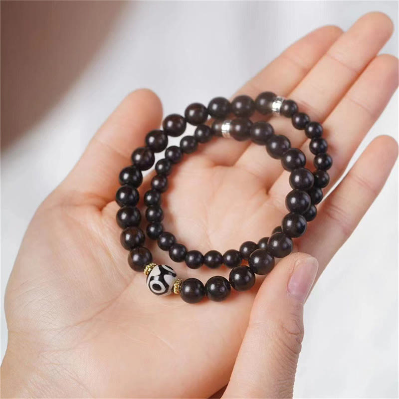 Pulsera de doble envoltura con cuentas Dzi de madera de ébano del Tíbet con Buddha Stones