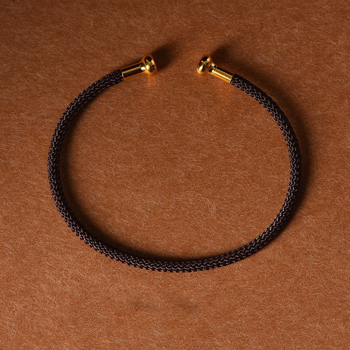 Pulsera de cuerda trenzada de la suerte hecha a mano con diseño simple de Buddha Stones