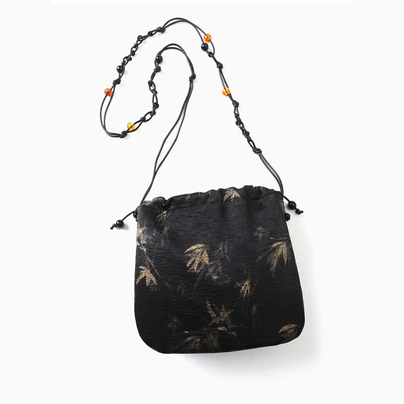 Bolso bandolera de acetato con estampado de hojas de bambú amarillo con Buddha Stones