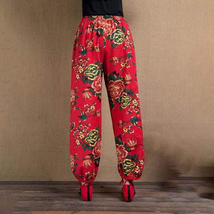 Pantalones bombachos con estampado de flores rojas y verdes de estilo étnico con Buddha Stones y bolsillos