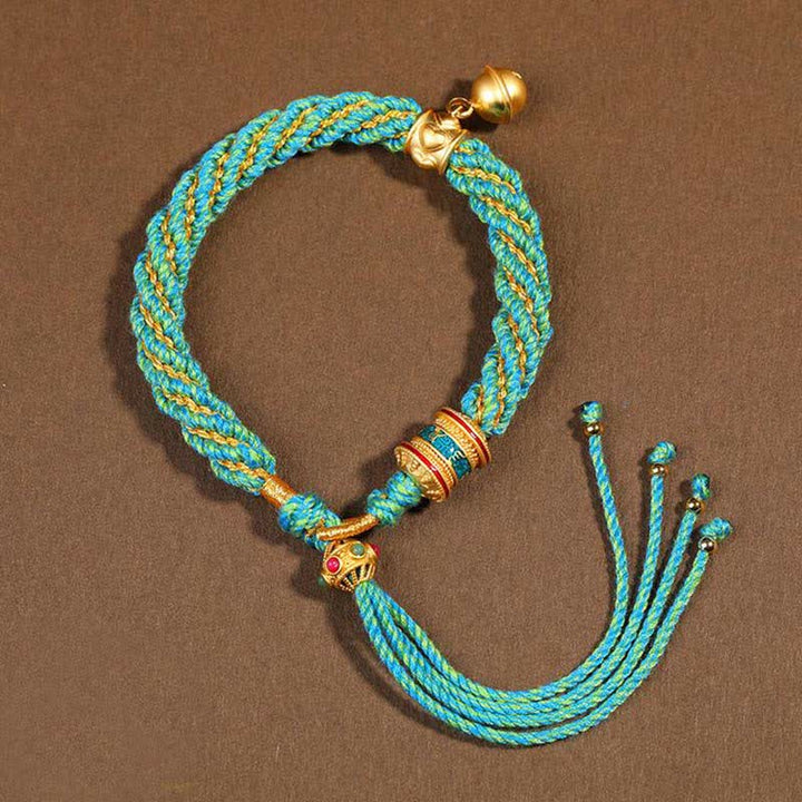 Pulsera de cuerda trenzada con dije de campana y rueda de oración Thangka de protección de la suerte hecha a mano tibetana