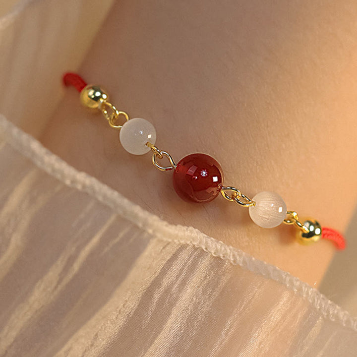 Pulsera de confianza con hilo trenzado y ojo de gato de ágata roja con Buddha Stones - image 5