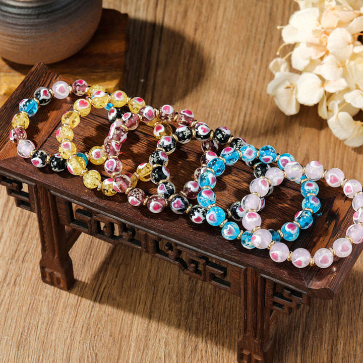 Pulsera de cuentas de cristal Liuli fluorescente luminosa con corazón de amor rosa de la familia de las bestias que tragan oro con Buddha Stones
