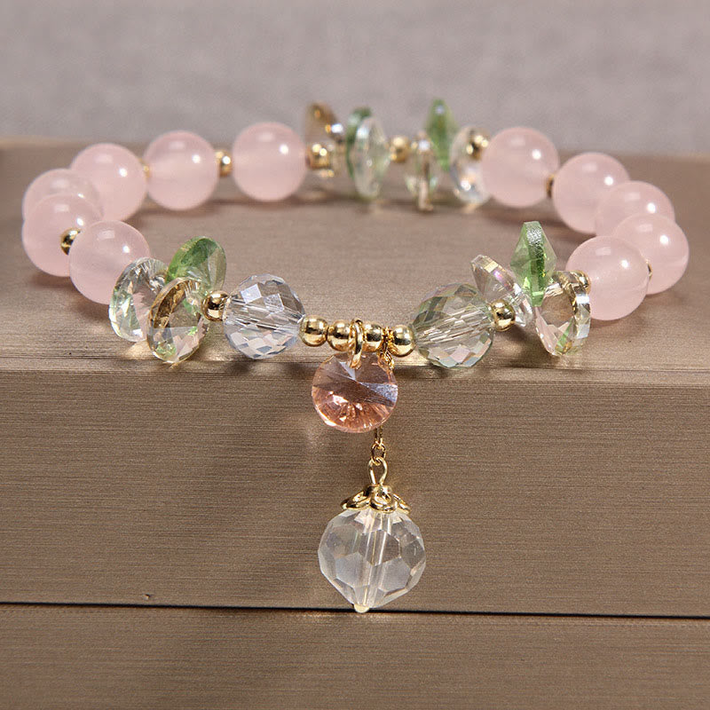 Pulsera con dije de paz y cristal rosa con ojo de gato y Buddha Stones