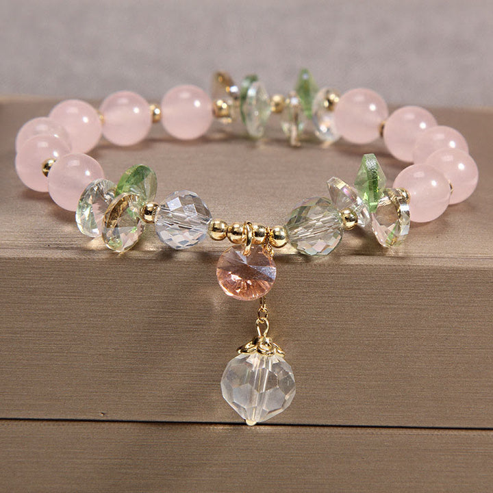 Pulsera con dije de paz y cristal rosa con ojo de gato y Buddha Stones