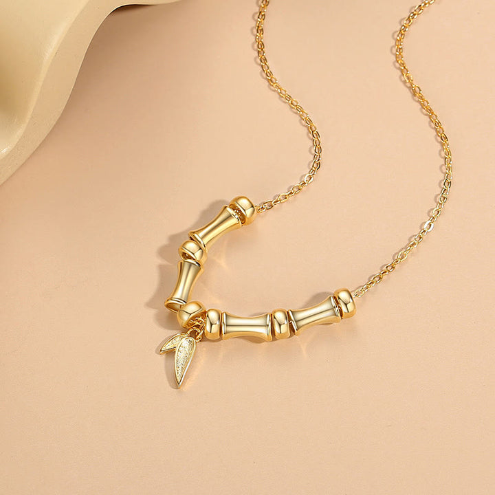 Colgante de collar de riqueza de acero titanio con patrón de bambú dorado con Buddha Stones