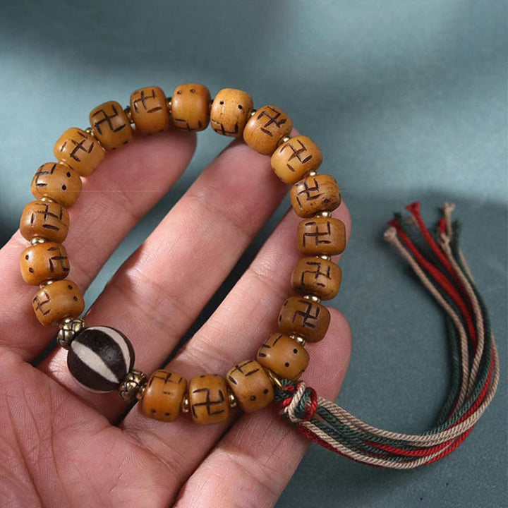 Buddha Stones, hueso de camello tibetano Natural, esvástica, cuentas Dzi, amuleto de Buda Shankha, Kirtimukha, pulsera con borla de protección de la suerte